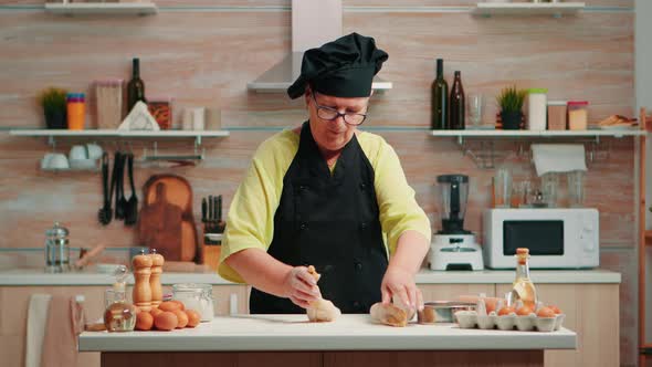 Woman Rolling Out the Dough