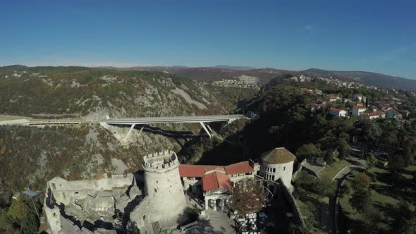 Aerial view of a bridge and castle ruins