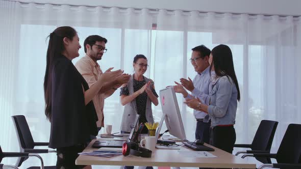 Successful Business People Celebrating Project Success at Office