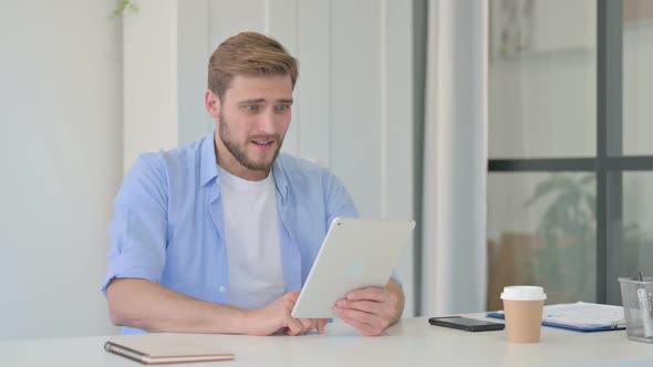 Young Creative Man Reacting to Loss on Tablet