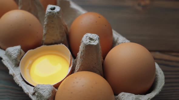 Fresh Chicken Brown Eggs in Cardboard Box on Table