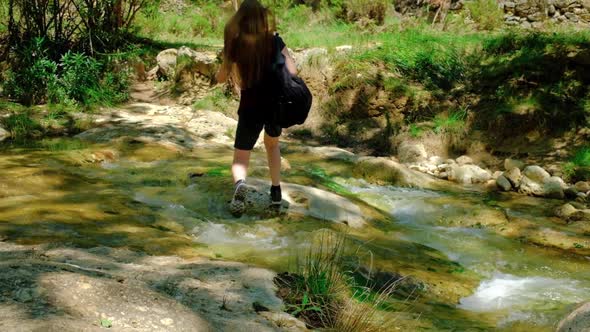 Woman is Crossing a River