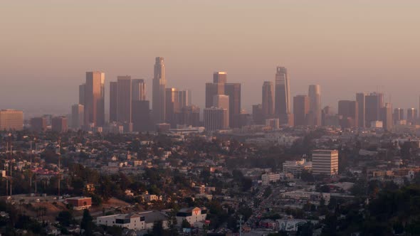 Residential houses and city skyline at sunset