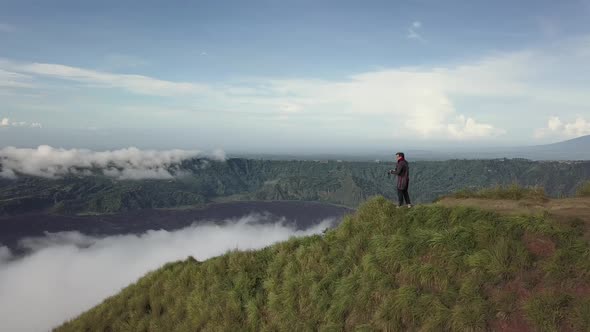  Photographer Traveler Photographs the Landscape on the Edge of the Mountain