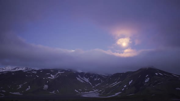 Timelapse of Misty Fog and Clouds Passing Over Mountains