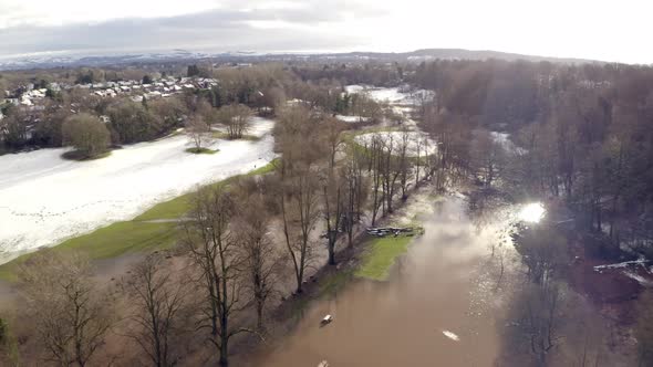 Aerial footage from Drone showing the river Bollin in Wilmslow, Cheshire after heavy rain, showing b