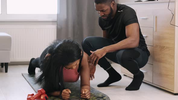 Couple of African Americans Doing Work Out at Home