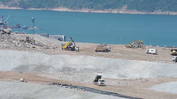 Climate change emergency. Landfill tip causes environmental destruction on Coast In Hongkong - Aeria