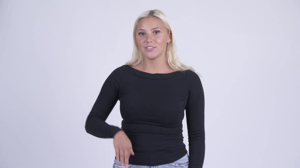 Young Happy Blonde Woman Presenting Something
