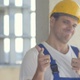 Worker at a construction site with thumbs up and smiling - VideoHive Item for Sale