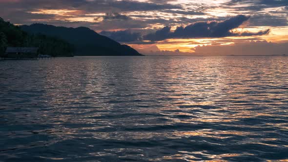 Sunset Over Kri and Monsuar, Calm Waves Moving on the Ocean Surface, West Papua, Raja Ampat