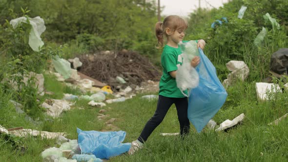 Volunteer Girl Cleaning Up Dirty Park From Plastic Bags, Bottles. Reduce Trash Nature Pollution