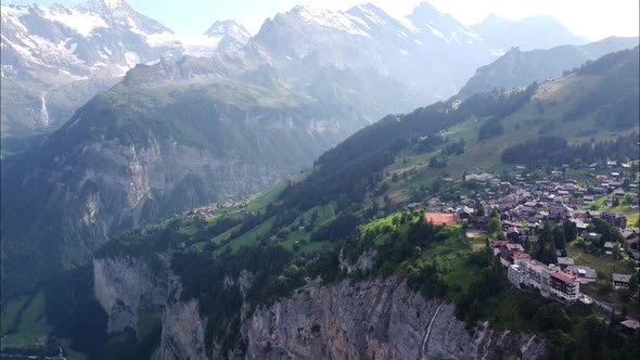 Murren townscape drone aerial view above swiss mountains and Lauterbrunnen valley in alps.