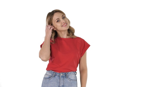 Young attractive happy model standing and smiling on white