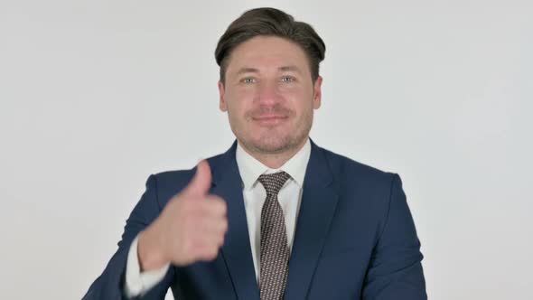 Middle Aged Businessman showing Thumbs Up Sign, White Background