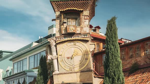 Tbilisi, Georgia. People Walking Near Famous Rezo Gabriadze Marionette Theater Clock Tower On Old