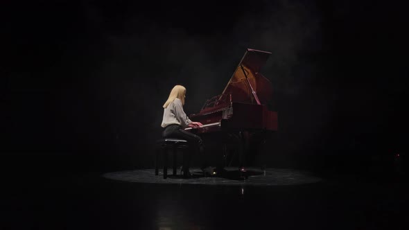 Woman Playing Classical Piano Concerto