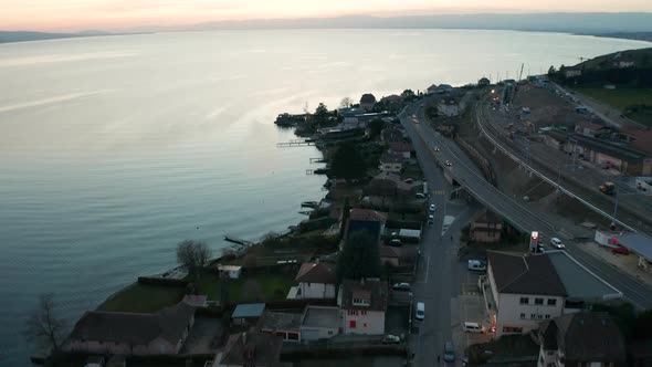 Aerial reveal of large lake near small town