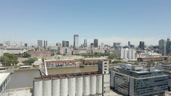 Aerial parallax left of Puerto Madero waterfront and Buenos Aires government buildings