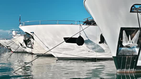 View of the sea port of Antibes, France. Moored yachts, blue water of the Mediterranean sea