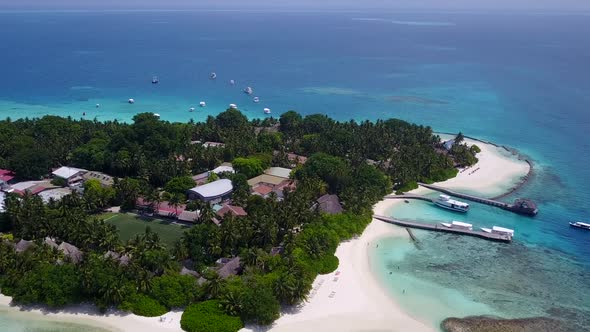 Aerial travel of marine coast beach by blue sea and sand background