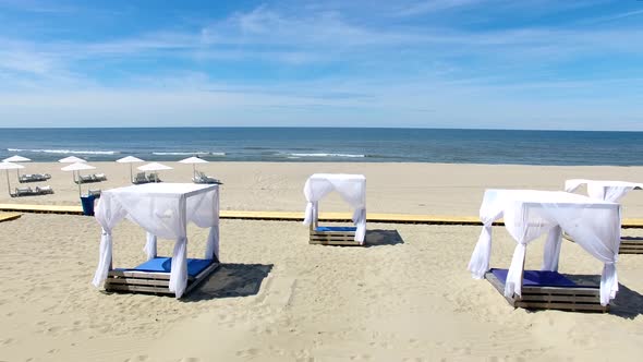 The wooden houses on a beach in summer