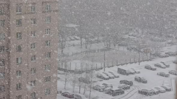 Heavy snowfall on city streets.