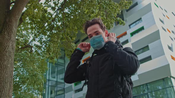 Portrait of a Young Guy Wearing a Mask and Thank the Doctors for Their Efforts