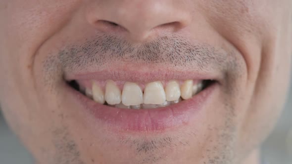 Close Up of Smiling Lips and Teeth of Gray Hair Man