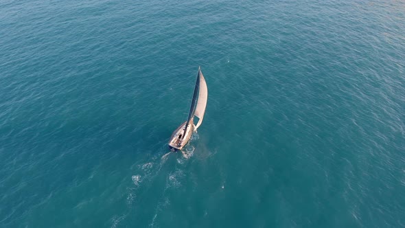 Aerial View. Yacht Sailing on Opened Sea. Sailing Boat. Yachting Video Footage. Yacht From Above