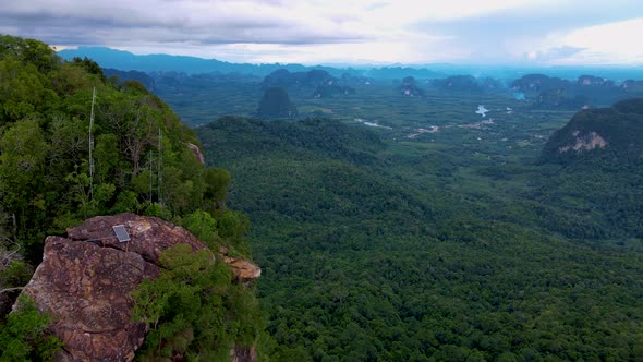 Dragon Crest Mountain Krabi Thailand a Young Traveler Sits on a Rock That Overhangs the Abyss with a