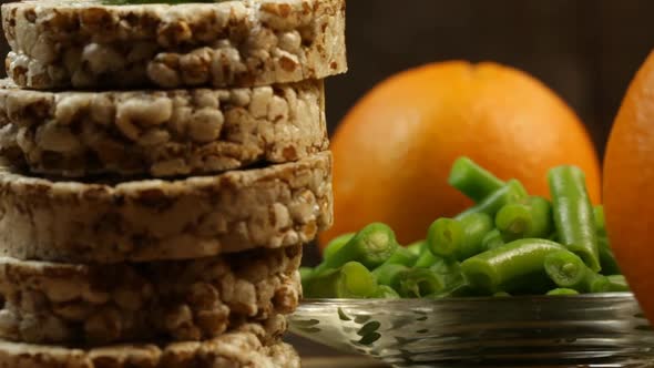 Healthy Food, Green String Beans, Bread Rolls And Orange Close