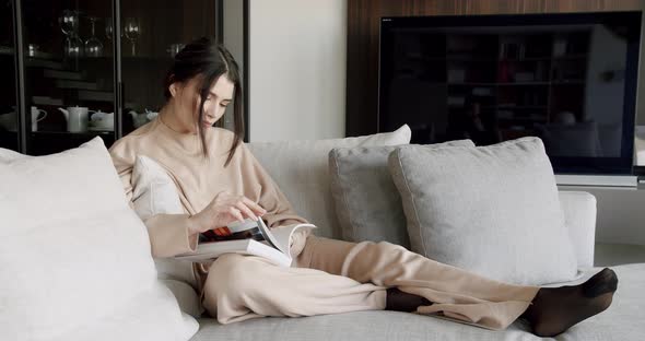 Dreamy Woman Sit Indoor Reading Book Enjoy Cozy Lazy Weekend at Modern Home