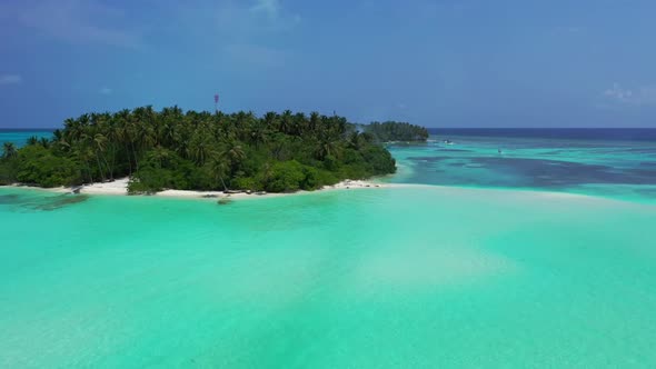 Aerial drone shot texture of paradise seashore beach voyage by blue green ocean and white sand backg