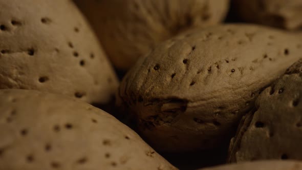 Cinematic, rotating shot of almonds on a white surface - ALMONDS