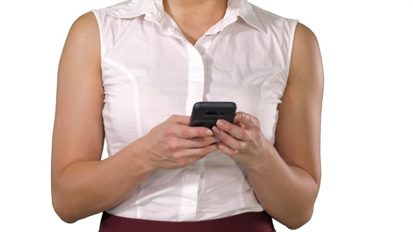 Women's Hands Holding Cell Telephone on White Background.