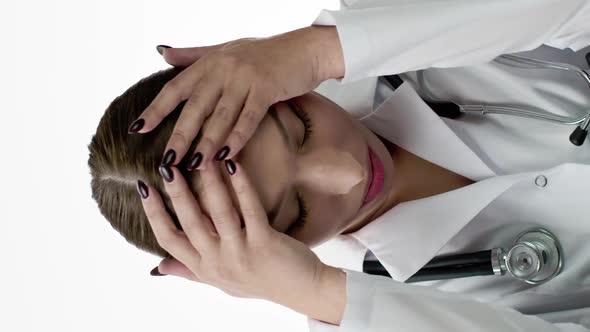 Vertical Shot Cute Doctor with Migraine Headache Grabs Hands Behind Head Feels Tired Despair