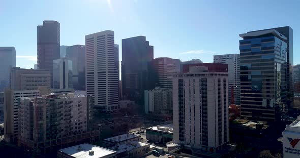 Denver City Skyline at noon on the 12th of January 2020. Drone pan across with crystal blue skies an