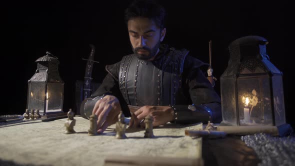 Chess pieces on the map in ancient times. War preparation in historical times. alt