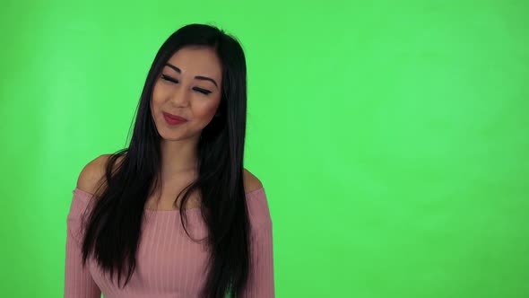 Young Attractive Asian Woman Smiles - Green Screen Studio