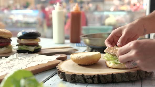 Hands Making a Burger.