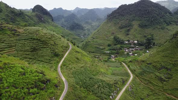 Aerial View of Crooked Path of Road on the Mountains in Asia Village