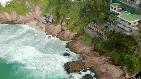 Beautiful picturesque Joatinga beach and cliff rock shoreline in Rio de Janeiro seen from above at s