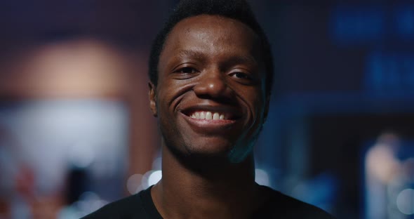 Young Man Smiling in Camera