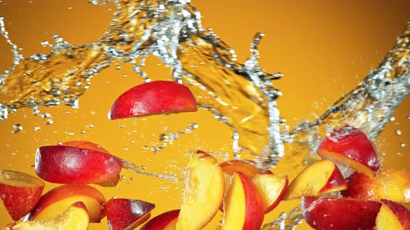 Super Slow Motion Shot of Flying Fresh Peach Slices and Water Side Splash at 1000Fps.