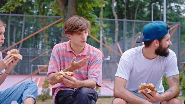 Hungry Group of Young People Take the Lunch Time