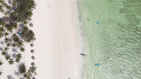 Vertical Video Kitesurfing Near the Shore of Zanzibar Tanzania Aerial View