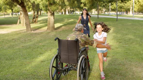 Excited Kids with Mom Running To Disabled Retired Military Dad