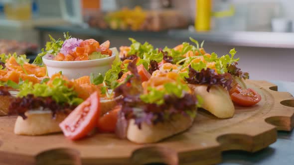 Beautiful Sandwiches Mix of Fresh Lettuce Leaves and Bright Vegetables on a Decorative Wooden Tray