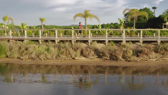 Young Man Walking on Bridge of Quinta Do Lago Algarve Portugal Europe